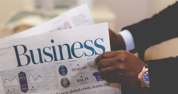Businessman reading a finance newspaper.